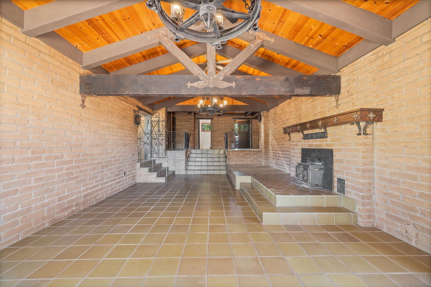 3981 Snow Creek Road Mariposa, CA 95338 - Photo 14 of 66 a view of a hall with wooden floor and a fireplace