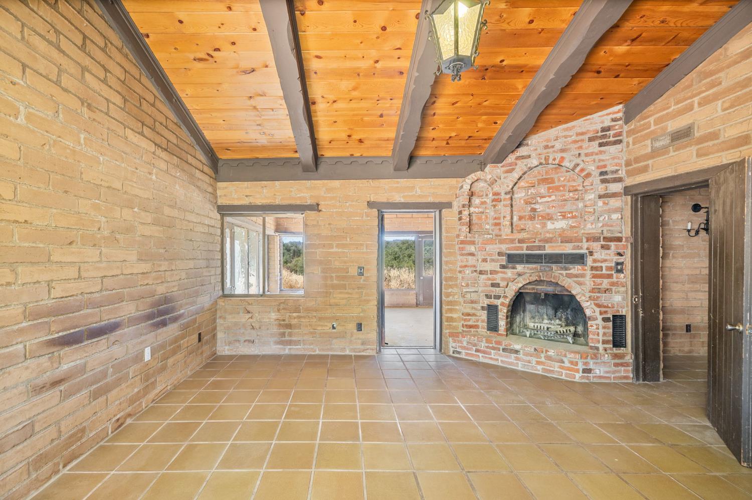 3981 Snow Creek Road Mariposa, CA 95338 - Photo 35 of 66 a view of empty room with a fireplace