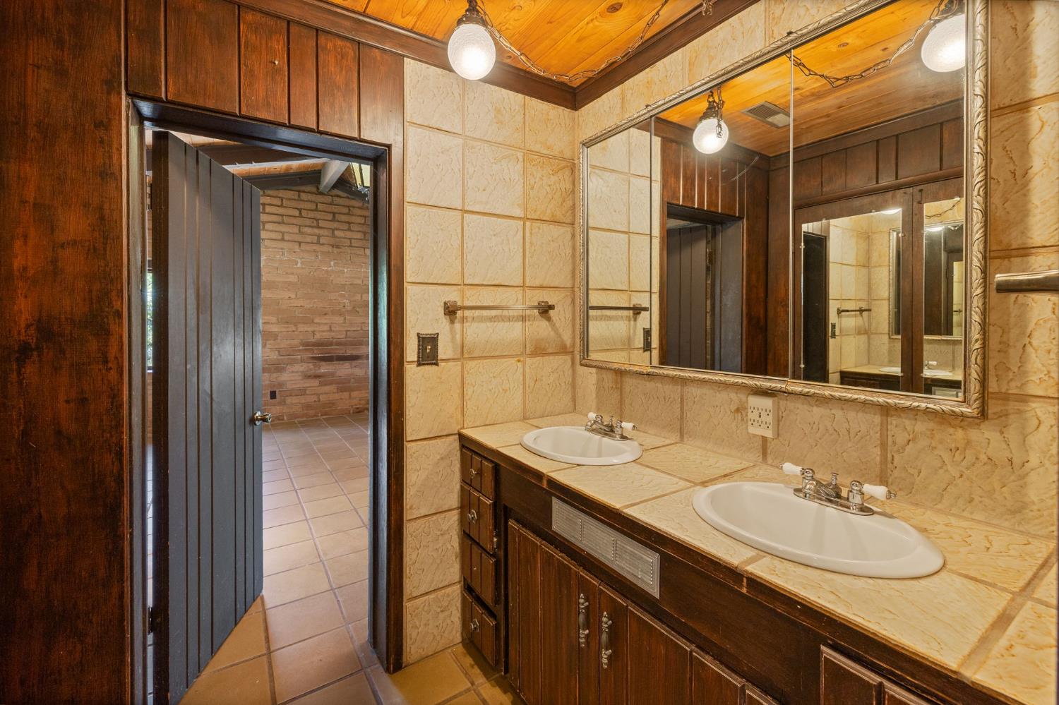 3981 Snow Creek Road Mariposa, CA 95338 - Photo 39 of 66 a bathroom with a sink and a mirror