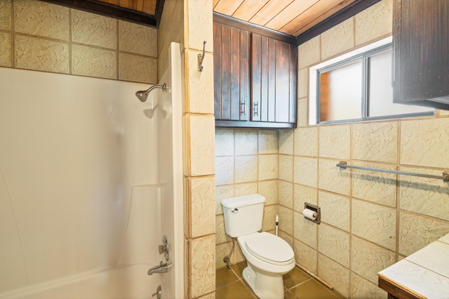 3981 Snow Creek Road Mariposa, CA 95338 - Photo 40 of 66 a bathroom with a granite countertop toilet and sink