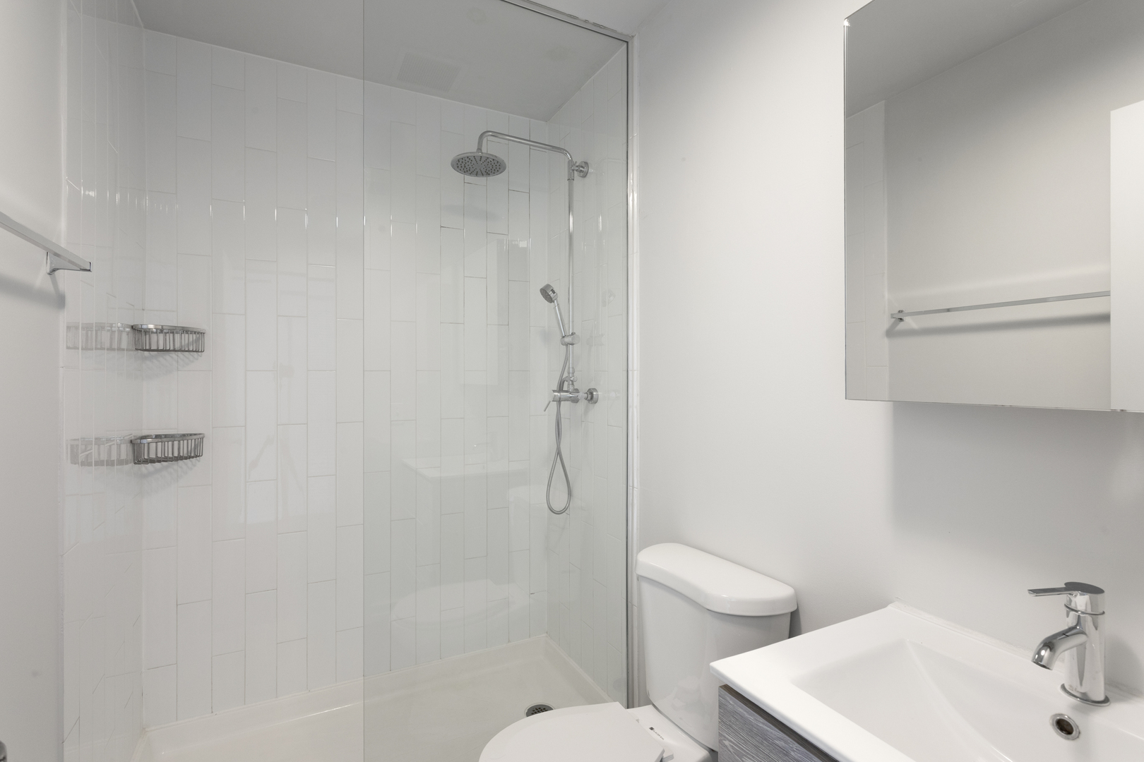 1325 West Wilson Avenue, Unit 601 Chicago, IL 60640 - Photo 8 of 19 a bathroom with a sink toilet and shower