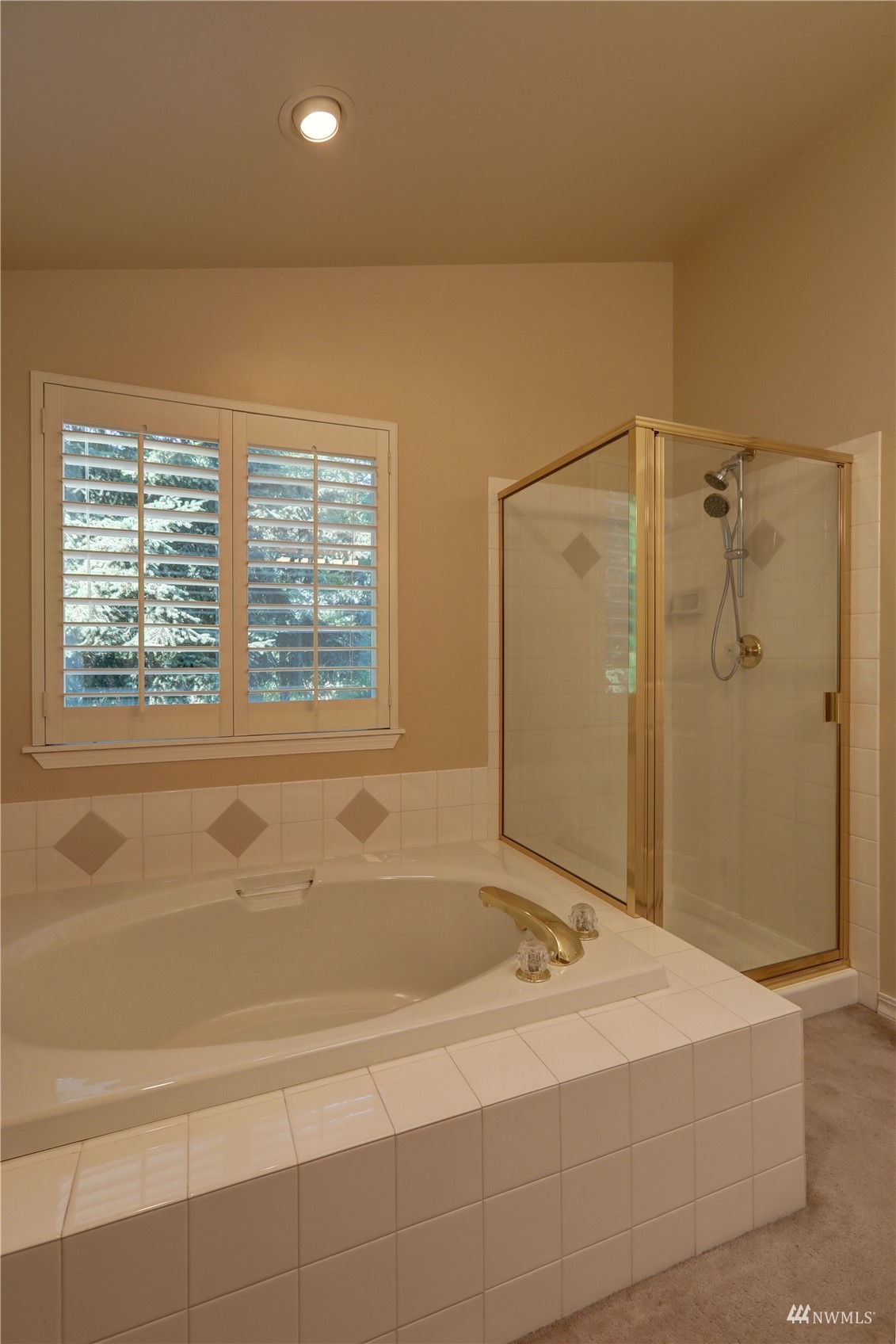 1635 Field Place Northeast Renton, WA 98059 - Photo 21 of 28 a bathroom with a tub and a shower