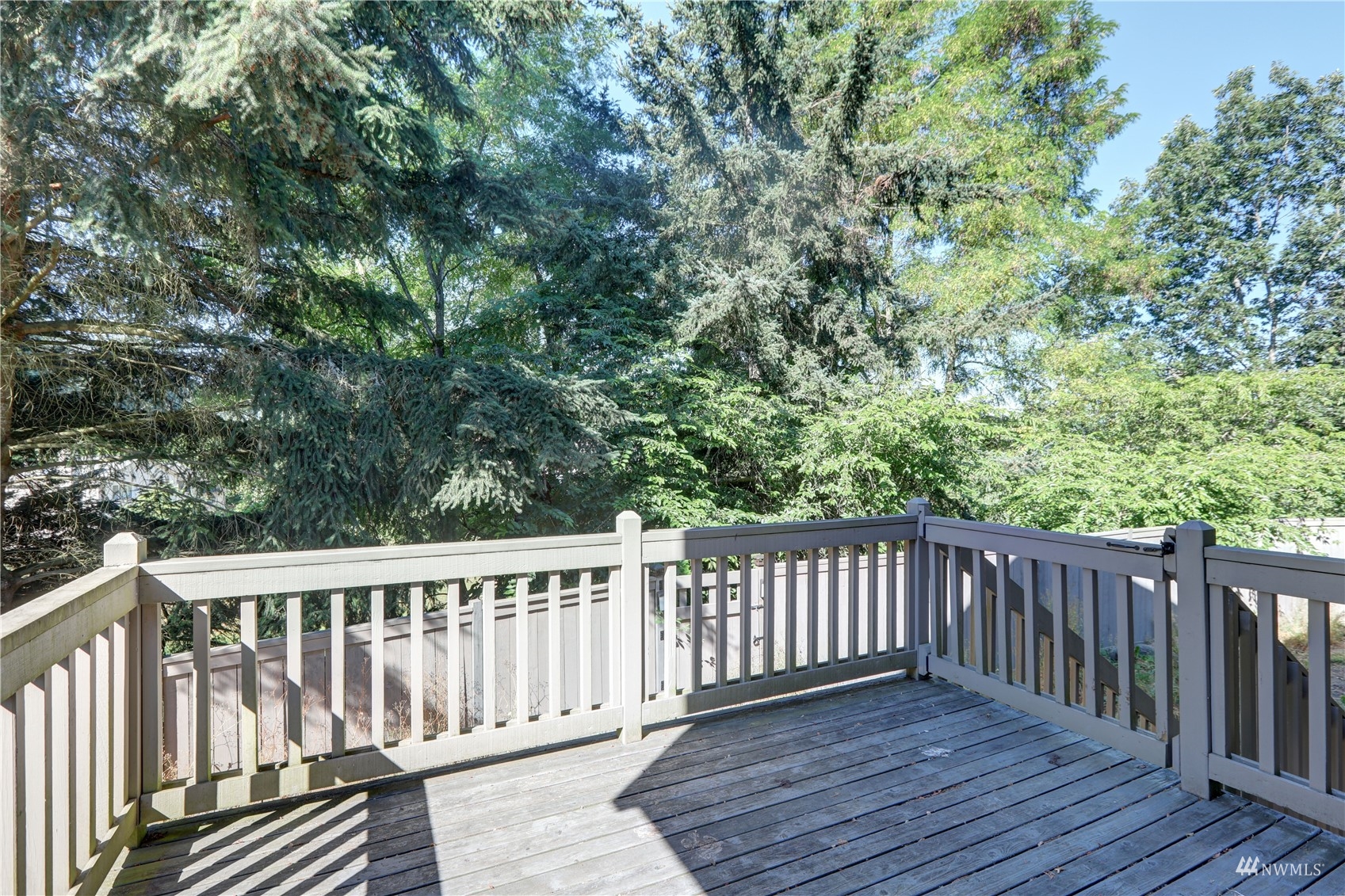 1635 Field Place Northeast Renton, WA 98059 - Photo 25 of 28 a balcony with wooden floor and fence
