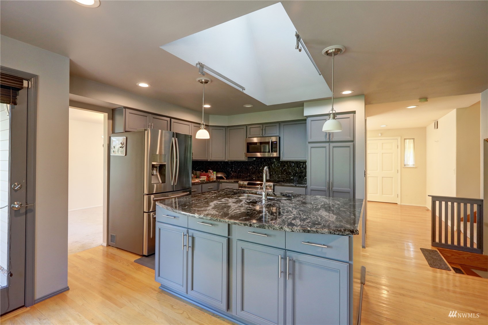 1635 Field Place Northeast Renton, WA 98059 - Photo 7 of 28 a kitchen with stainless steel appliances granite countertop a sink and a refrigerator