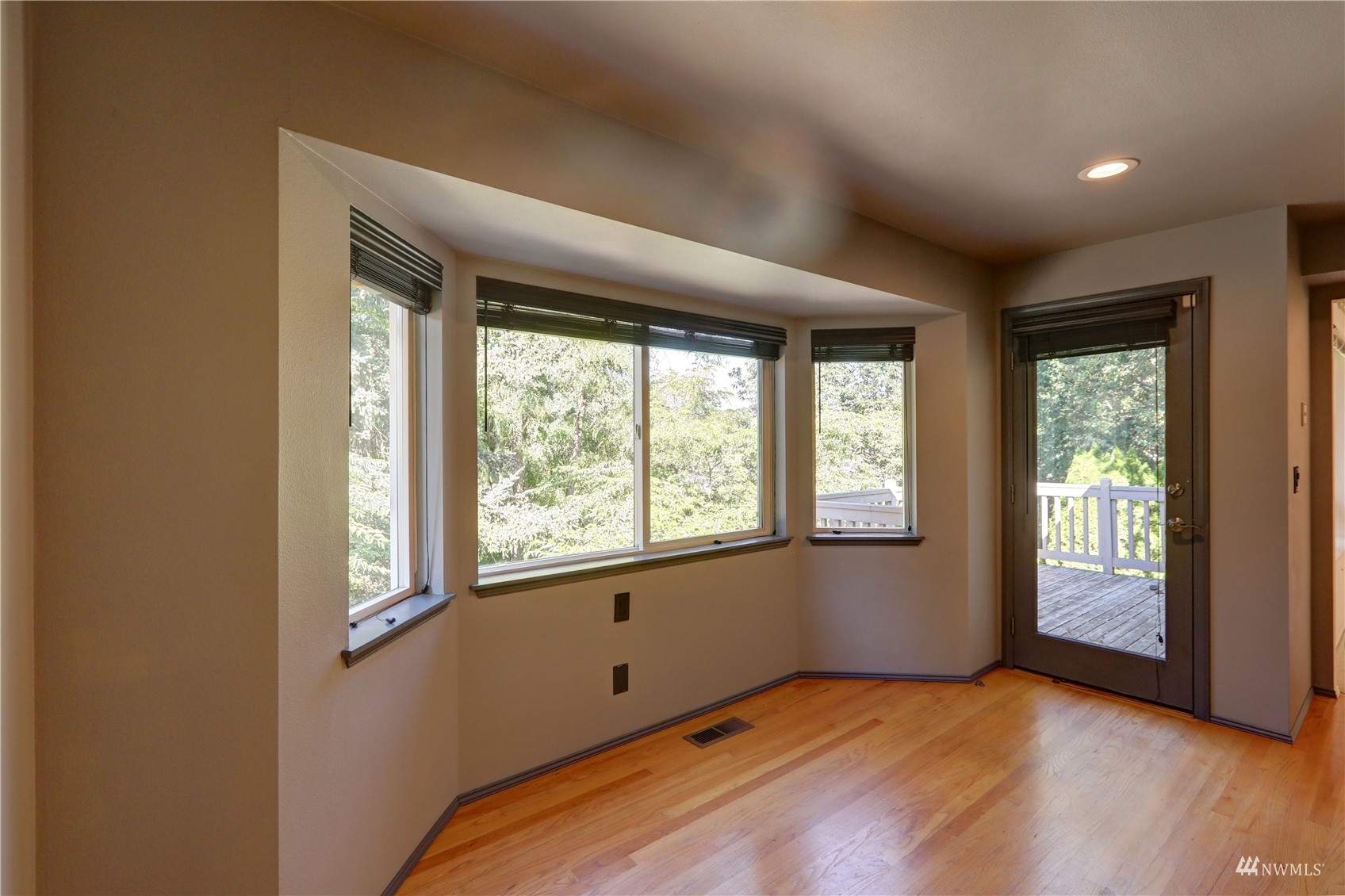 1635 Field Place Northeast Renton, WA 98059 - Photo 10 of 28 a view of an empty room with wooden floor and a window