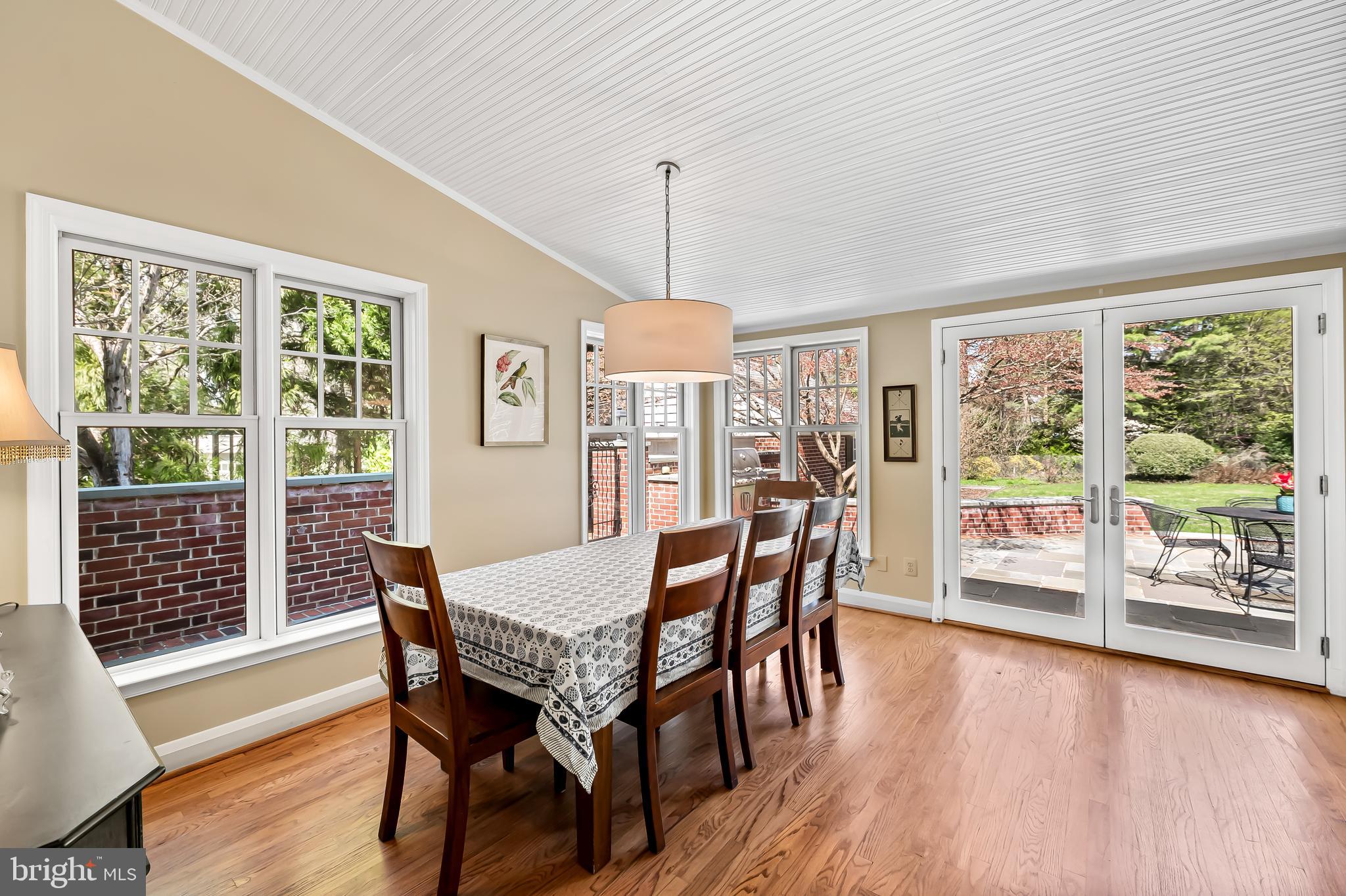 5911 Meadowood Road Baltimore, MD 21212 - Photo 12 of 52 a view of a dining room with furniture window and wooden floor