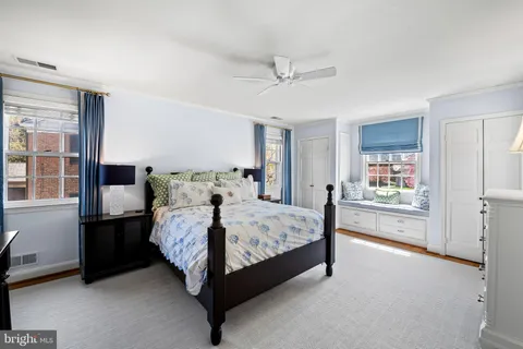 a picture of a bench in front of a window