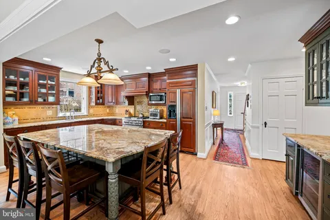 a dining table with chairs and wooden floor