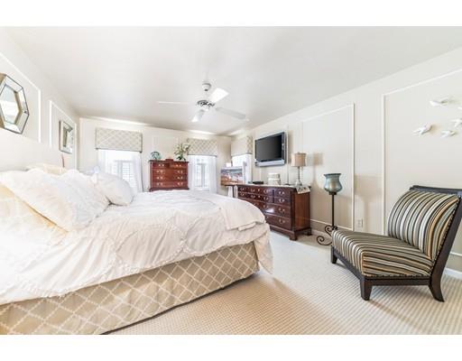 20 Seager Farm Road Marshfield, MA 02050 - Photo 19 of 30 a spacious bedroom with a bed and a chandelier