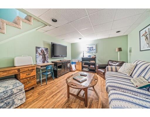 20 Seager Farm Road Marshfield, MA 02050 - Photo 26 of 30 a living room with furniture and a flat screen tv