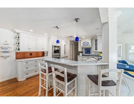 20 Seager Farm Road Marshfield, MA 02050 - Photo 10 of 30 a kitchen with cabinets and chairs