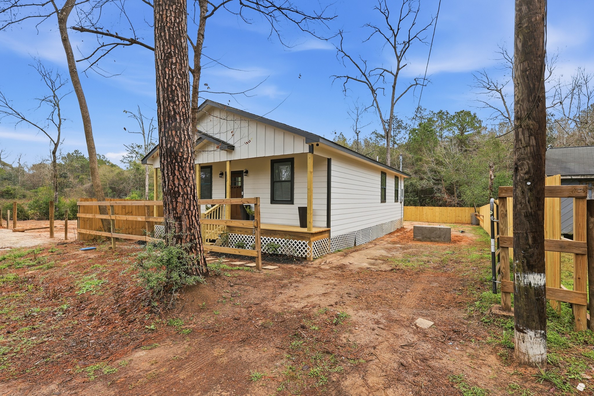 160 Oak Lane Shepherd, TX 77371 - Photo 3 of 15 a view of a house with backyard and a tree