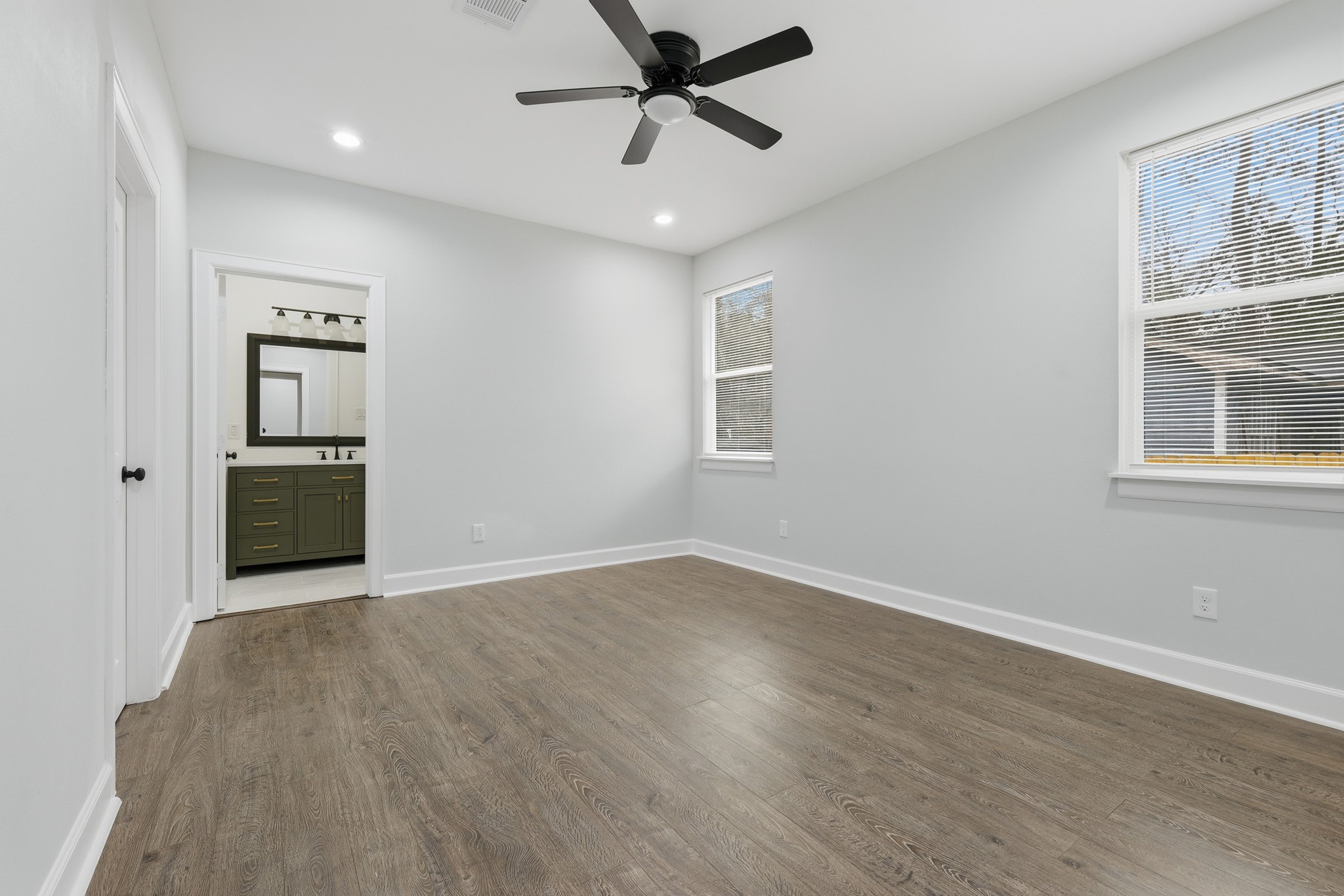 160 Oak Lane Shepherd, TX 77371 - Photo 9 of 15 wooden floor in an empty room with a window