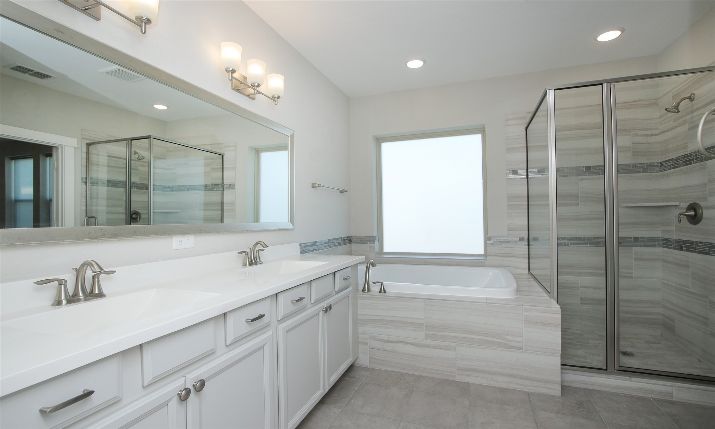 12502 Malachite Way Houston, TX 77077 - Photo 19 of 41 Primary bathroom feature dual sinks, soaking tub and separate shower