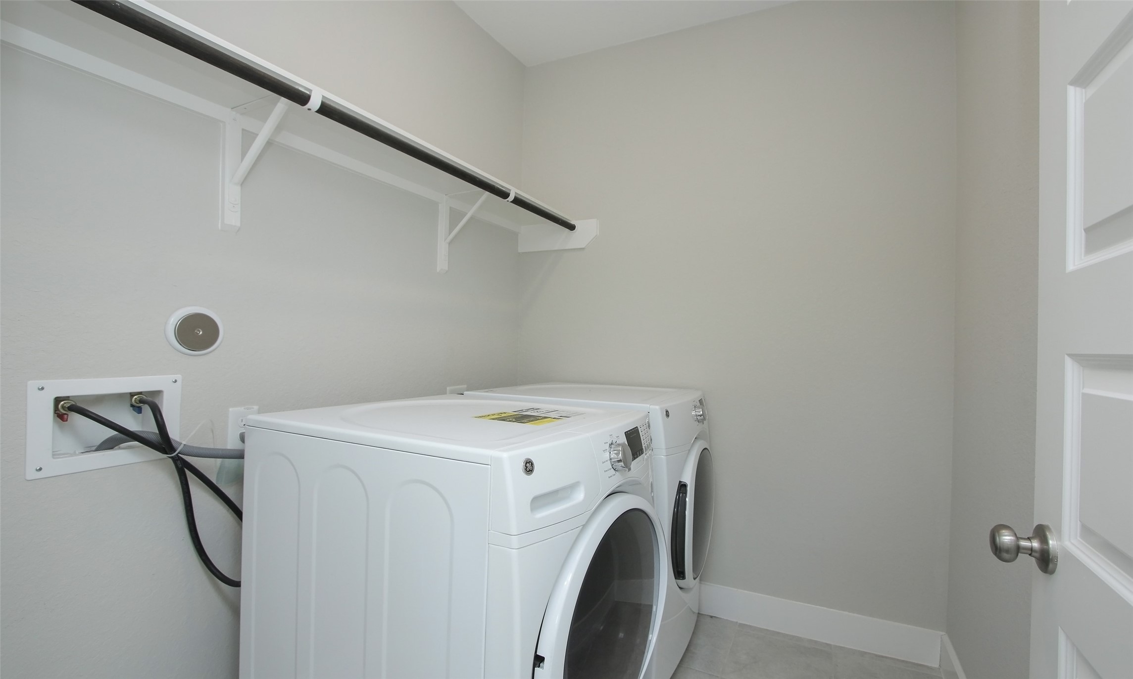12502 Malachite Way Houston, TX 77077 - Photo 24 of 41 The laundry room is located on the second floor of the home with the front loading washer and dryer included with the home