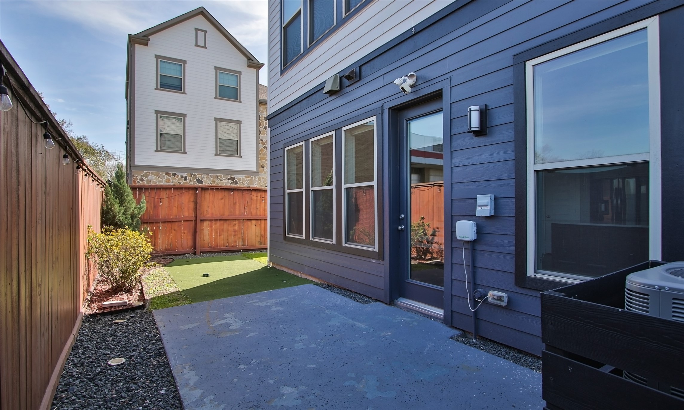 12502 Malachite Way Houston, TX 77077 - Photo 36 of 41 The back patio includes a concrete patio and grass area