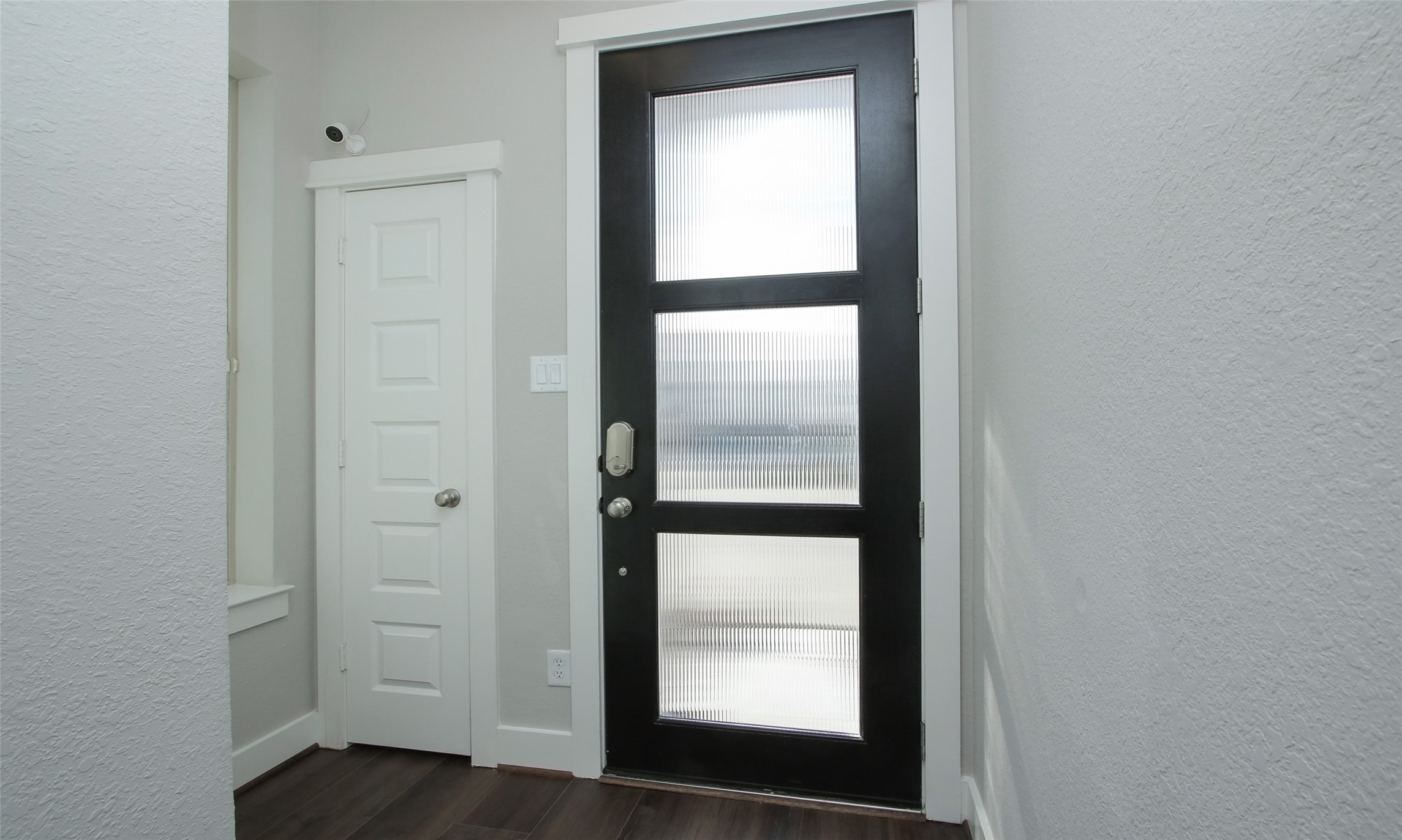 12502 Malachite Way Houston, TX 77077 - Photo 5 of 41 View of the entry door with a coat closet to the left