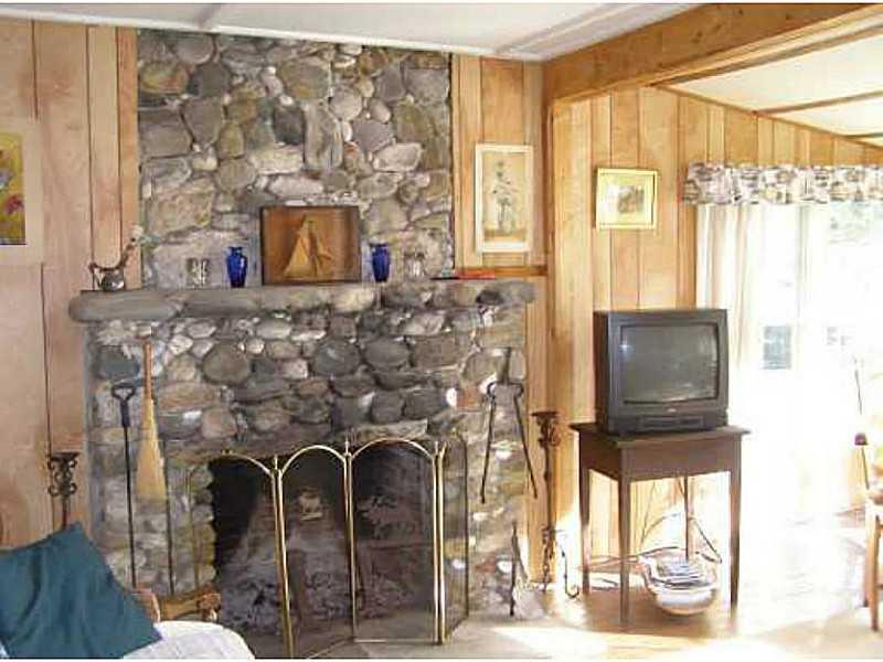 5 High Street Boothbay, ME 04544 - Photo 6 of 7 Living Room. Large living room with...