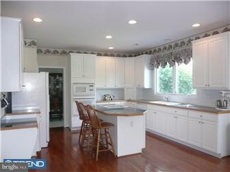 48 Hope Road Holland, PA 18966 - Photo 5 of 12 a kitchen with a sink window and cabinets