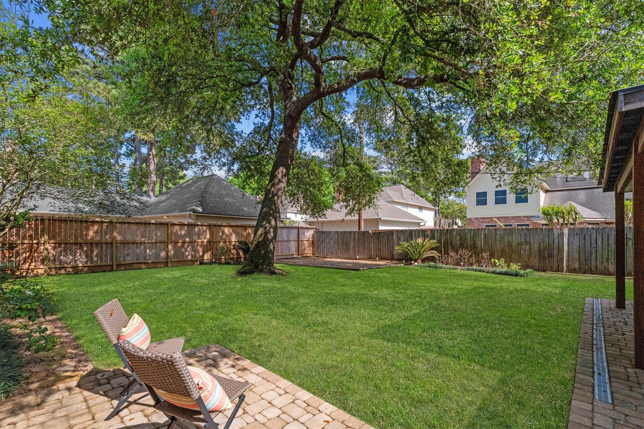 16267 Salmon Lane Spring, TX 77379 - Photo 39 of 48 Many options of outdoor seating and entertaining, and a dedicated space for a play set round out the backyard.