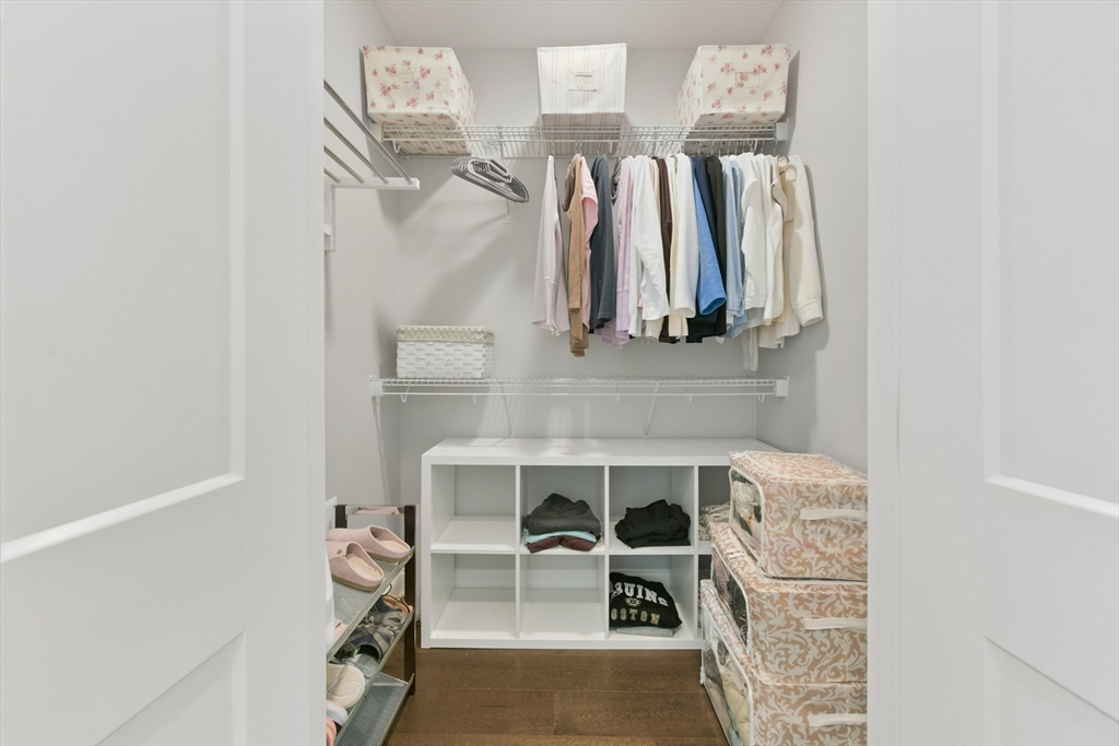 635 Old Post Road, Unit 2209 Sharon, MA 02067 - Photo 18 of 42 a view of walk in closet with clothes and shoes