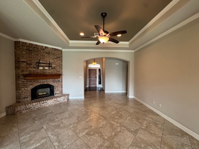 8305 Raintree Drive College Station, TX 77845 - Photo 2 of 9 a view of a livingroom with a fireplace a chandelier and windows