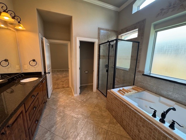 8305 Raintree Drive College Station, TX 77845 - Photo 5 of 9 a bathroom with a double vanity sink mirror and shower