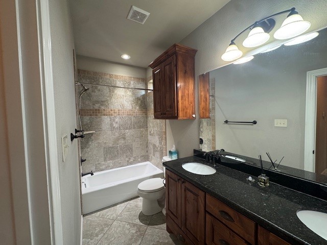8305 Raintree Drive College Station, TX 77845 - Photo 6 of 9 a bathroom with a double vanity sink and a mirror