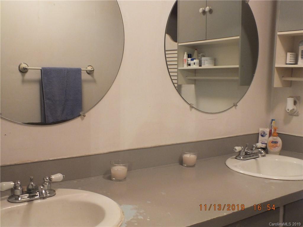 1136 Garnette Road Lancaster, SC 29720 - Photo 13 of 22 a bathroom with a sink mirror and vanity