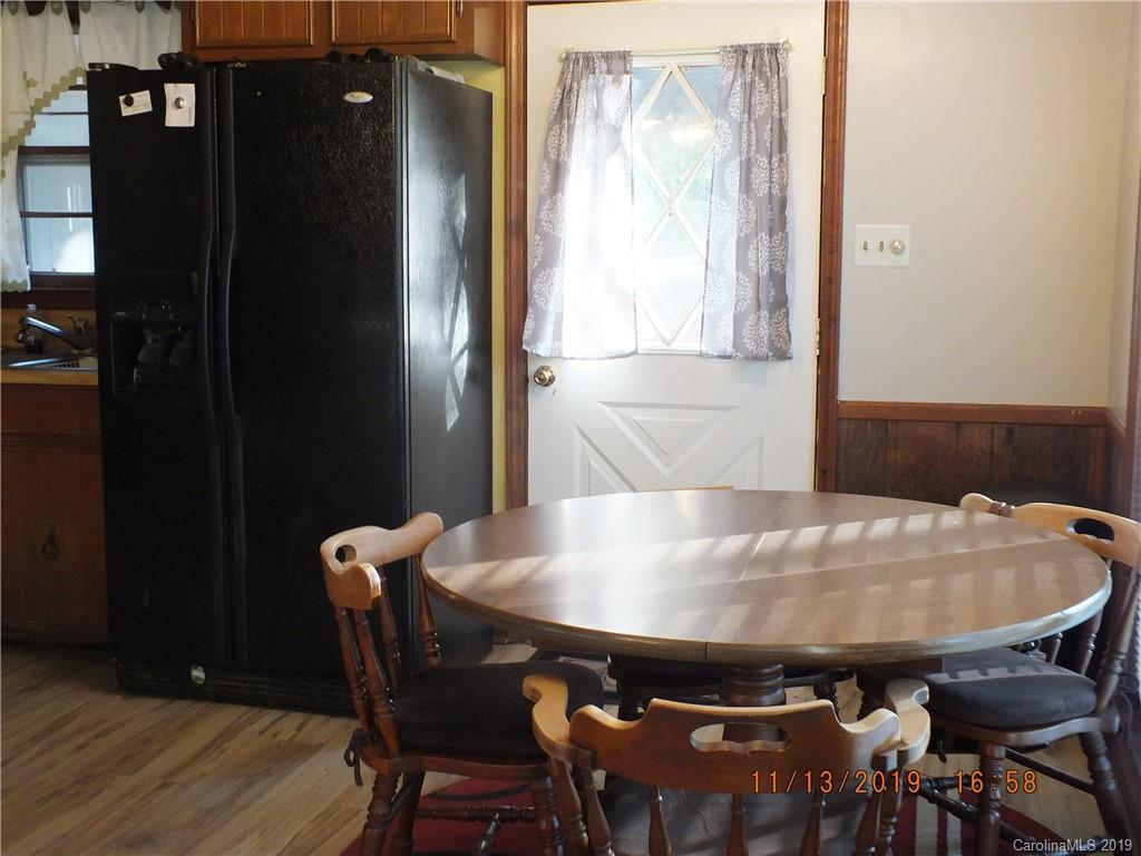 1136 Garnette Road Lancaster, SC 29720 - Photo 4 of 22 a view of a dining room with furniture and wooden floor