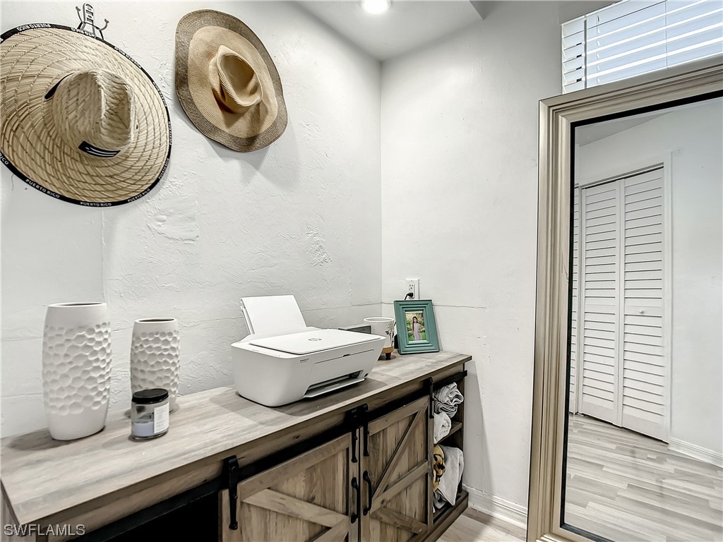 2437 42nd Terrace Southwest Naples, FL 34116 - Photo 22 of 34 a view of dining room and wooden door
