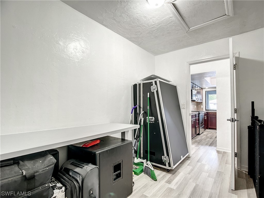 2437 42nd Terrace Southwest Naples, FL 34116 - Photo 24 of 34 a view of a room with gym equipment