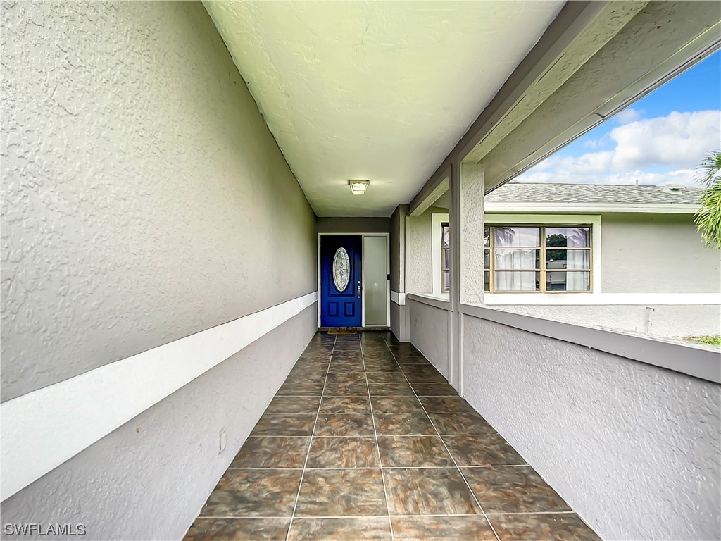 2437 42nd Terrace Southwest Naples, FL 34116 - Photo 3 of 34 a view of an entryway