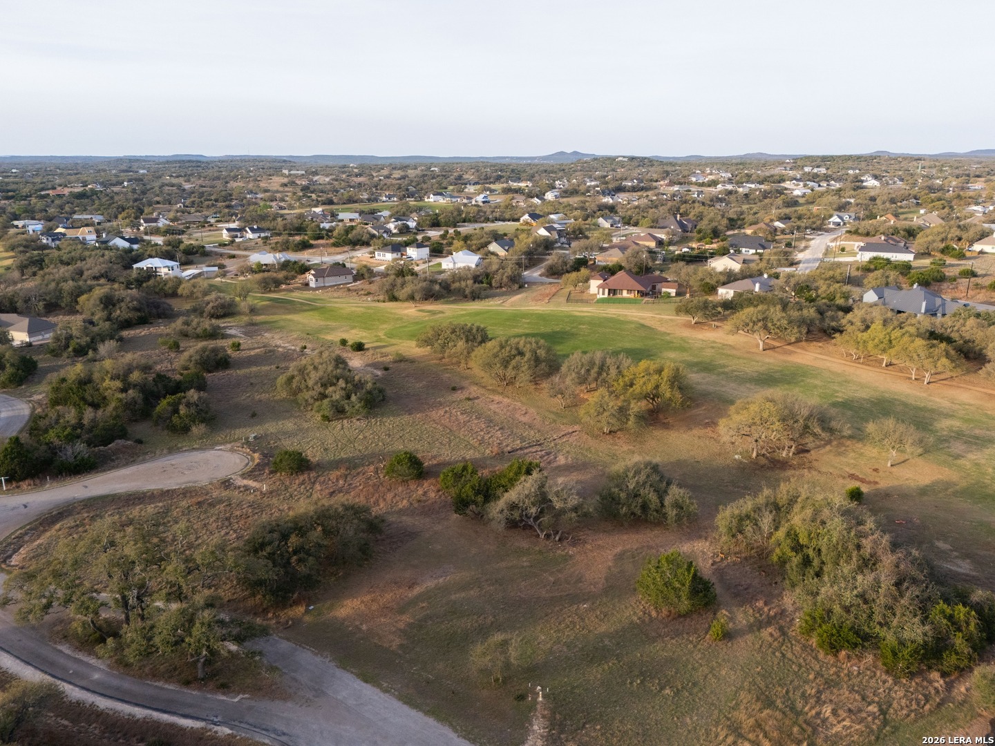116 South Jesse Stiff Blanco, TX 78606 - Photo 11 of 11 an aerial view of residential houses with outdoor space