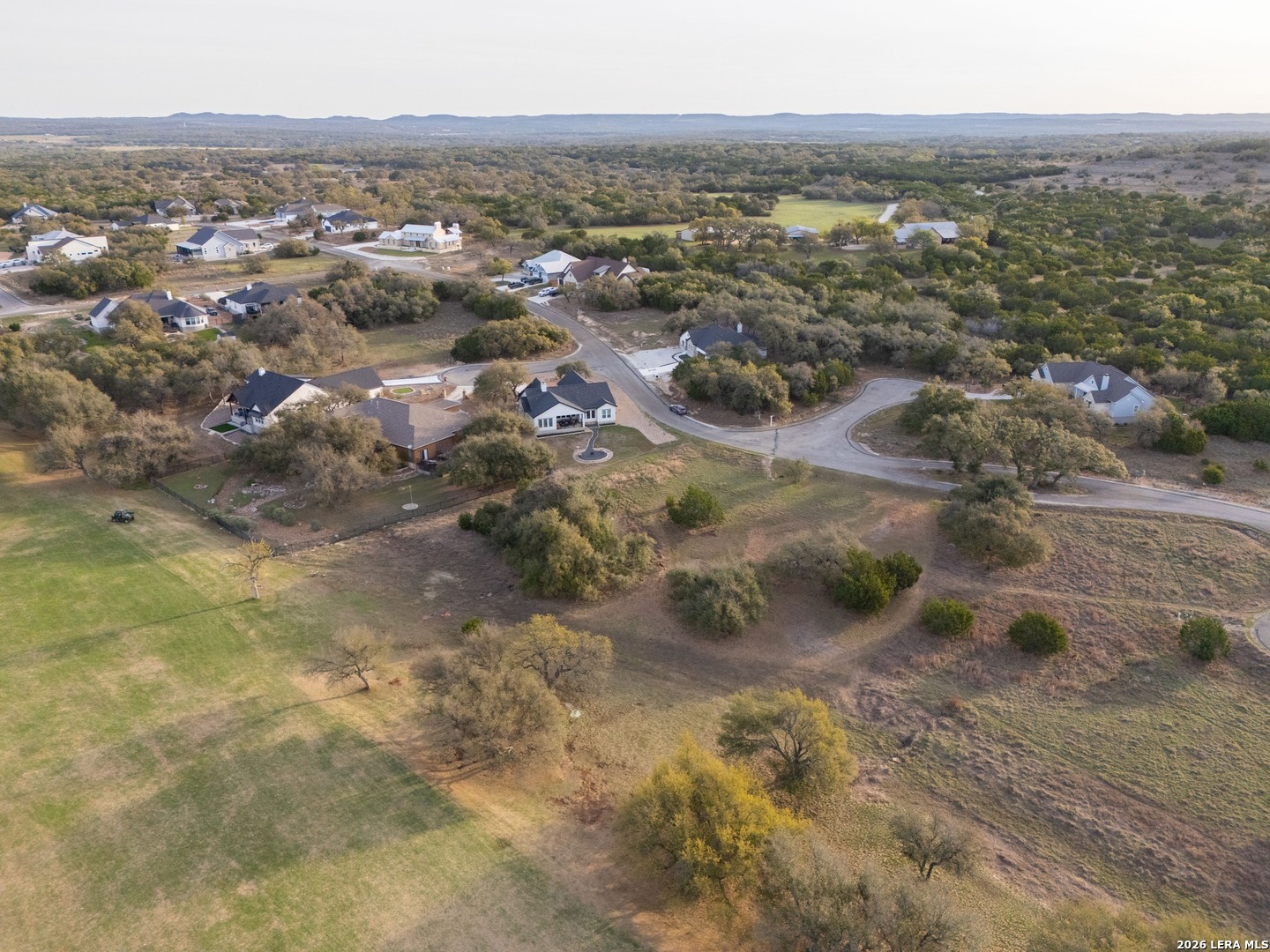 116 South Jesse Stiff Blanco, TX 78606 - Photo 5 of 11 an aerial view of residential houses with outdoor space
