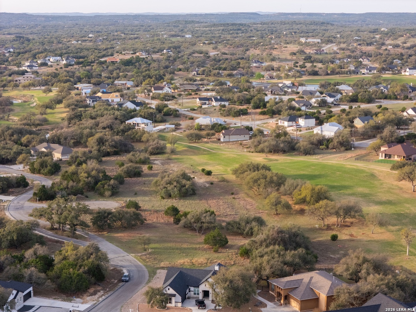 116 South Jesse Stiff Blanco, TX 78606 - Photo 6 of 11 an aerial view of residential houses with outdoor space