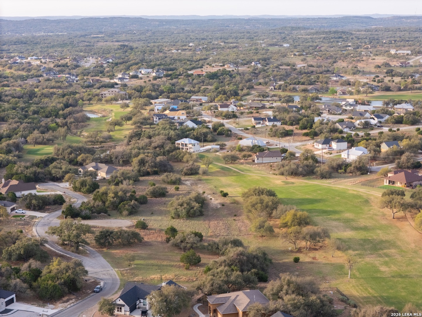 116 South Jesse Stiff Blanco, TX 78606 - Photo 7 of 11 an aerial view of residential house and lake view