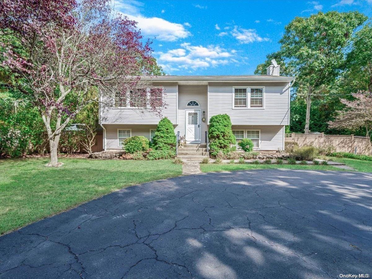 7 Maple Street Hampton Bays, NY 11946 - Photo 1 of 1 a front view of house with yard and green space