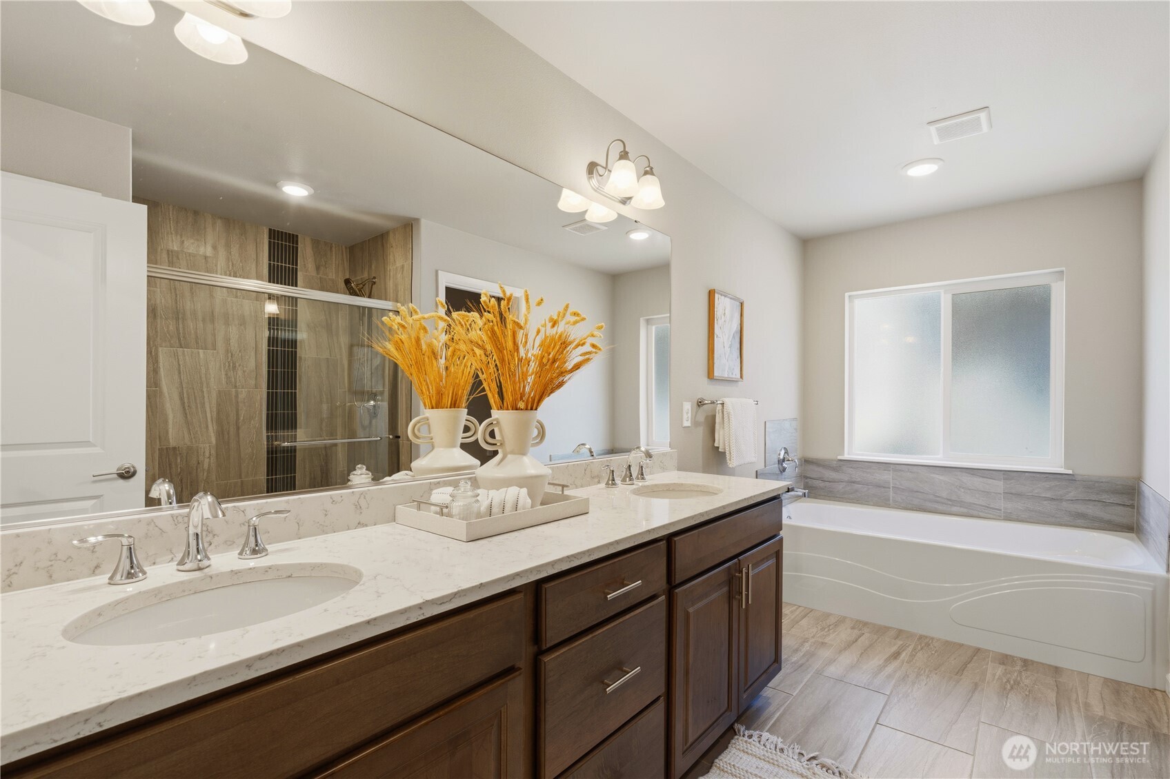 23615 43rd Drive Southeast Bothell, WA 98021 - Photo 22 of 35 a spacious bathroom with a double vanity sink a mirror and a bathtub