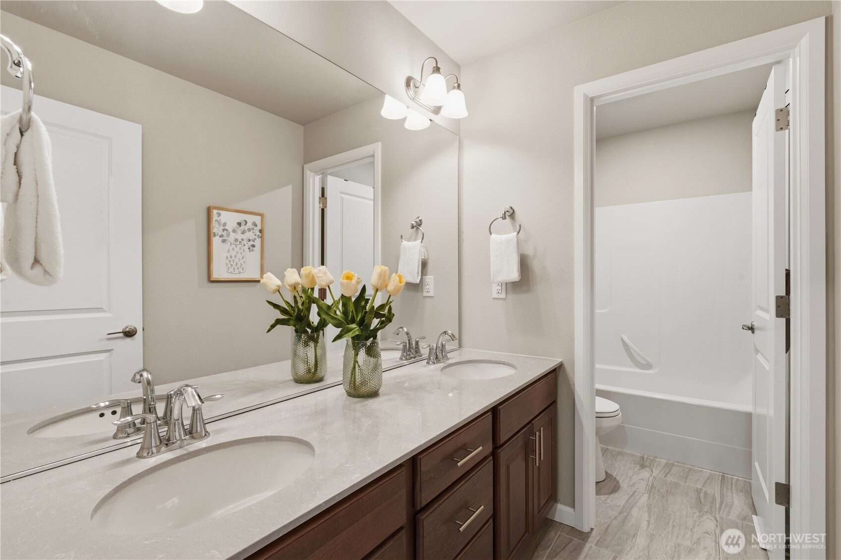 23615 43rd Drive Southeast Bothell, WA 98021 - Photo 29 of 35 a bathroom with a granite countertop sink a large mirror and a shower