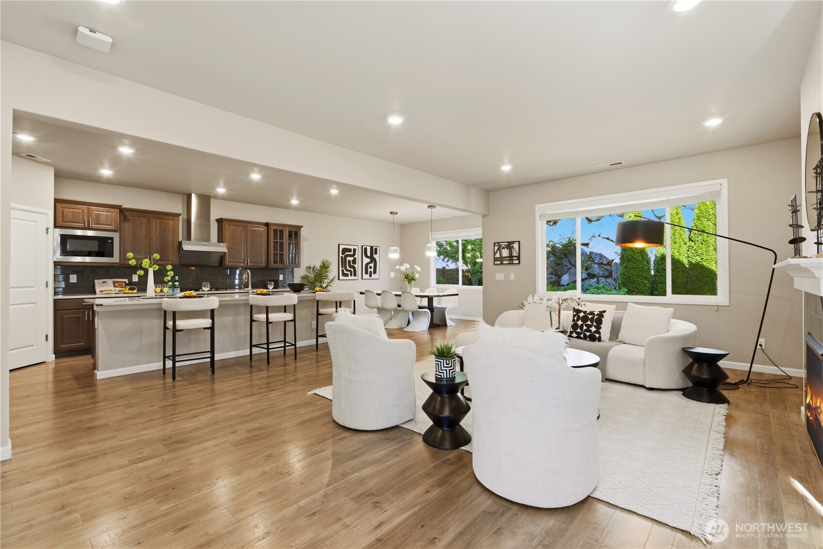 23615 43rd Drive Southeast Bothell, WA 98021 - Photo 3 of 35 a living room with furniture a wooden floor and a kitchen