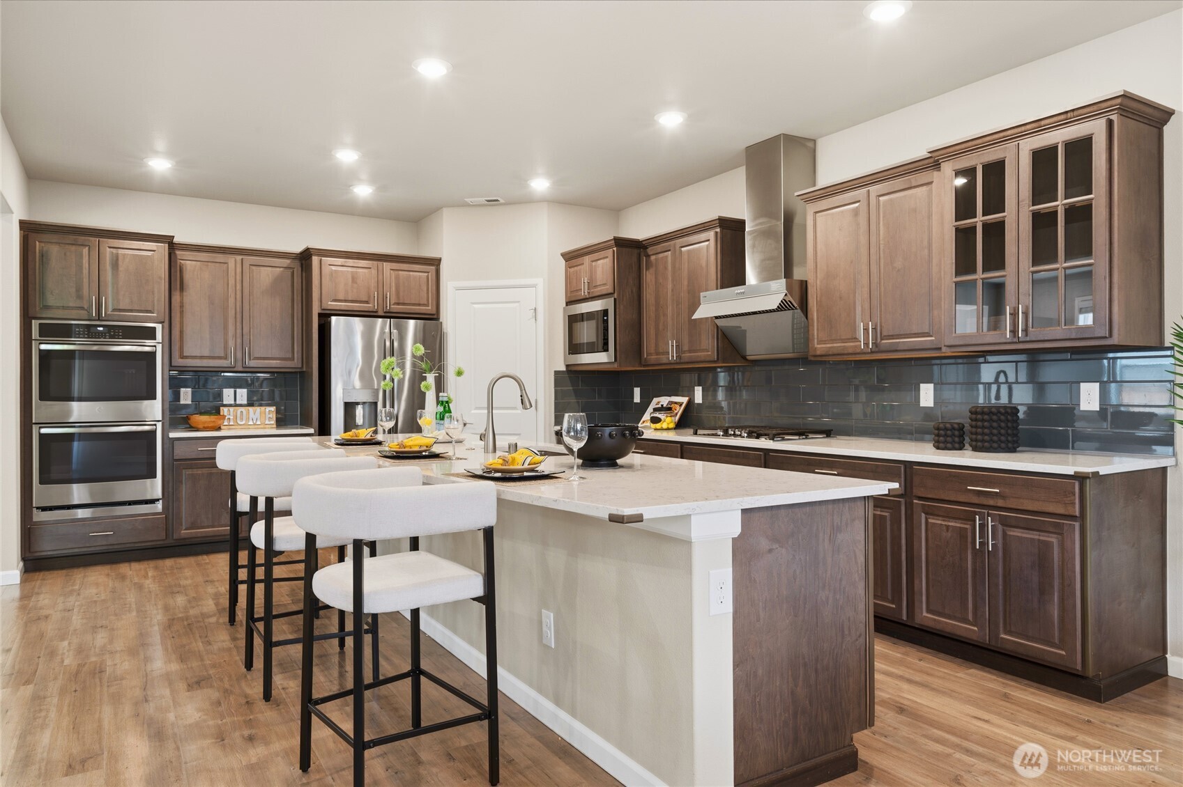 23615 43rd Drive Southeast Bothell, WA 98021 - Photo 9 of 35 a kitchen with stainless steel appliances granite countertop a stove a sink a microwave a refrigerator and cabinets