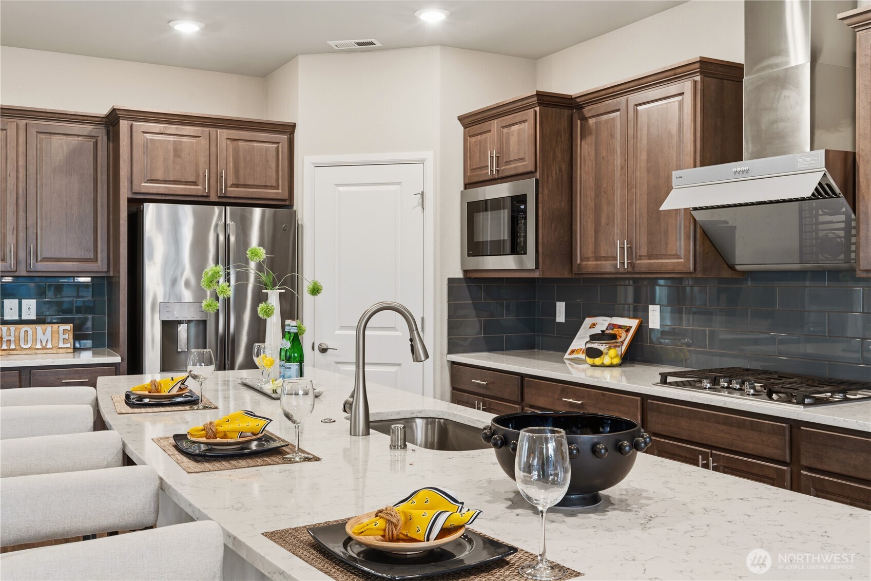 23615 43rd Drive Southeast Bothell, WA 98021 - Photo 10 of 35 a kitchen with stainless steel appliances a stove a sink and a microwave