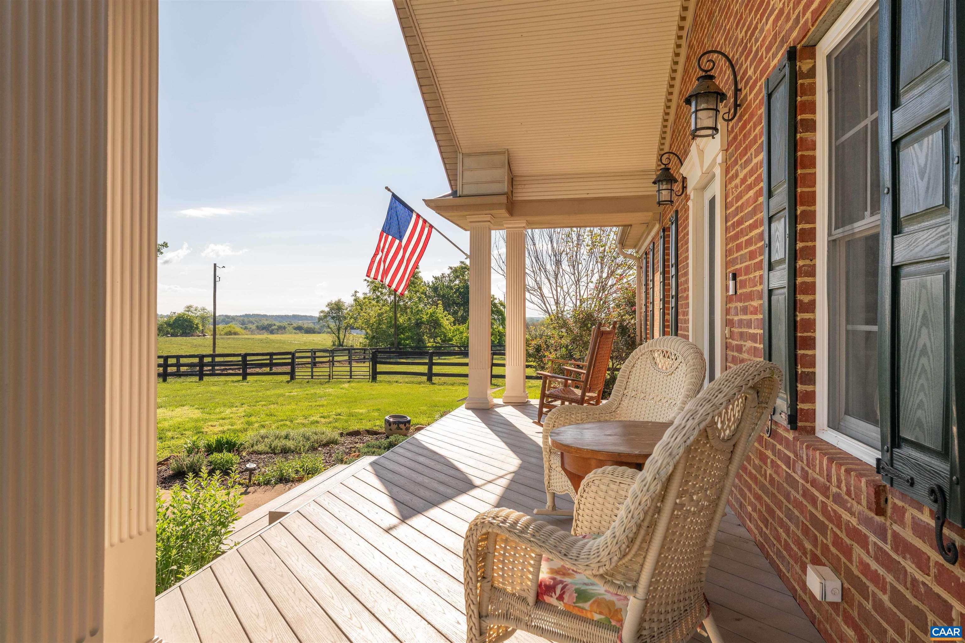 3486 Fredericksburg Road Ruckersville, VA 22968 - Photo 37 of 37 a view of a balcony with couch and chairs