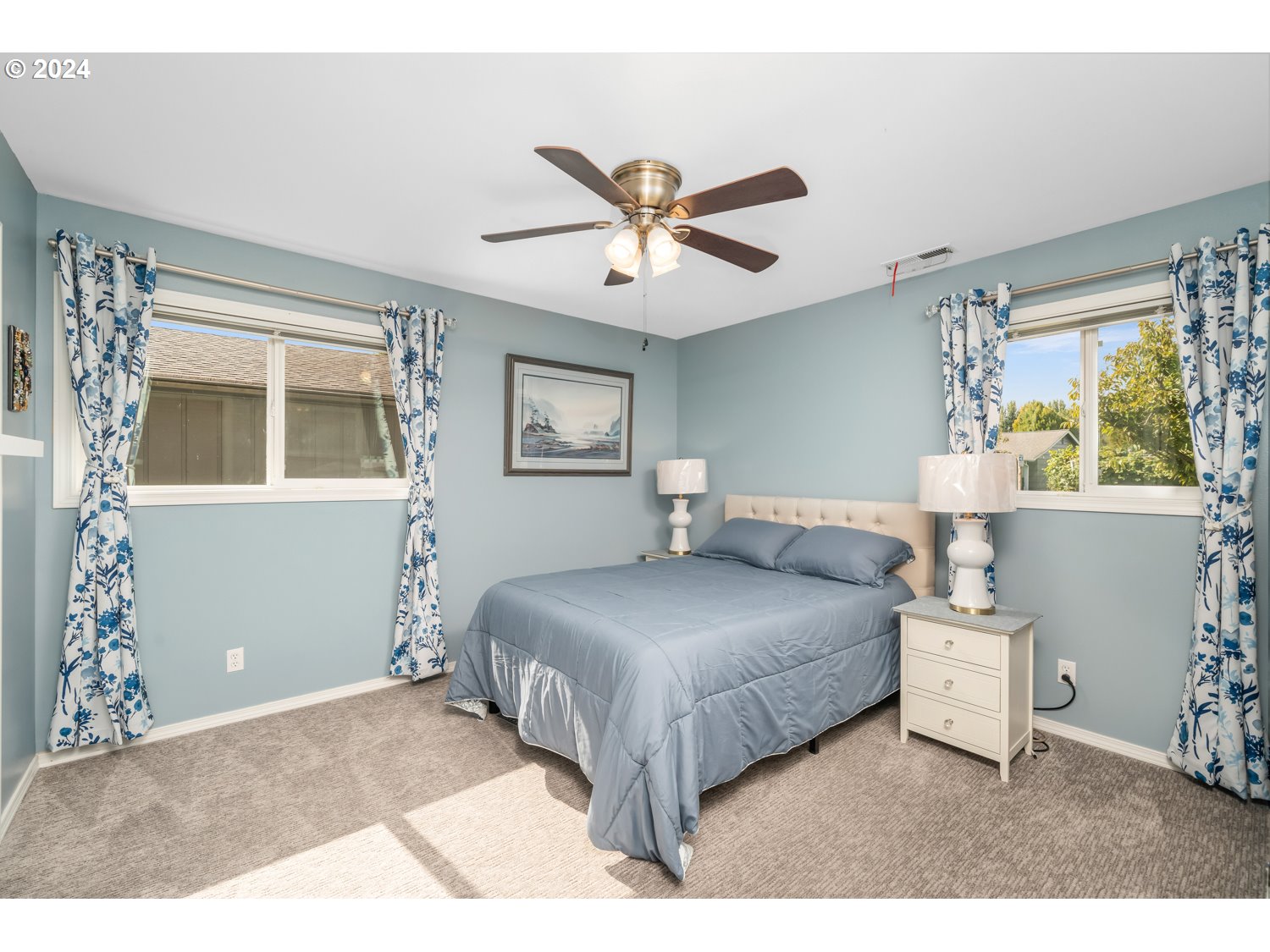 3217 Maple Street Longview, WA 98632 - Photo 16 of 32 a bedroom with a bed and window