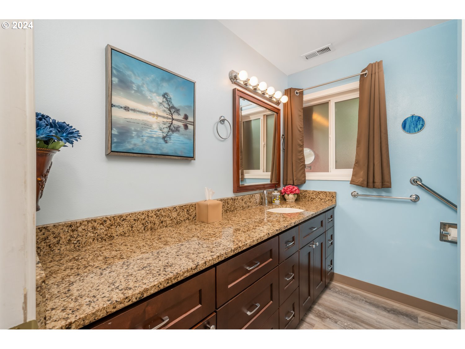 3217 Maple Street Longview, WA 98632 - Photo 22 of 32 a bathroom with a sink double vanity and a mirror