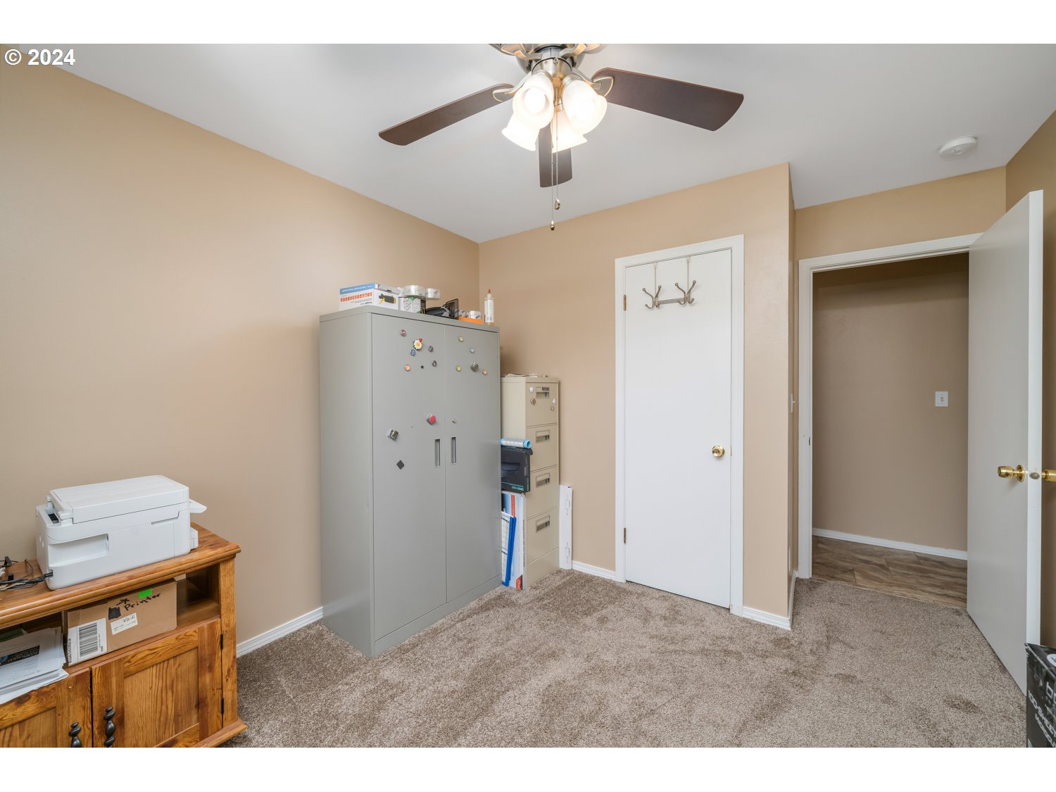 3217 Maple Street Longview, WA 98632 - Photo 26 of 32 a kitchen with refrigerator and a chandelier