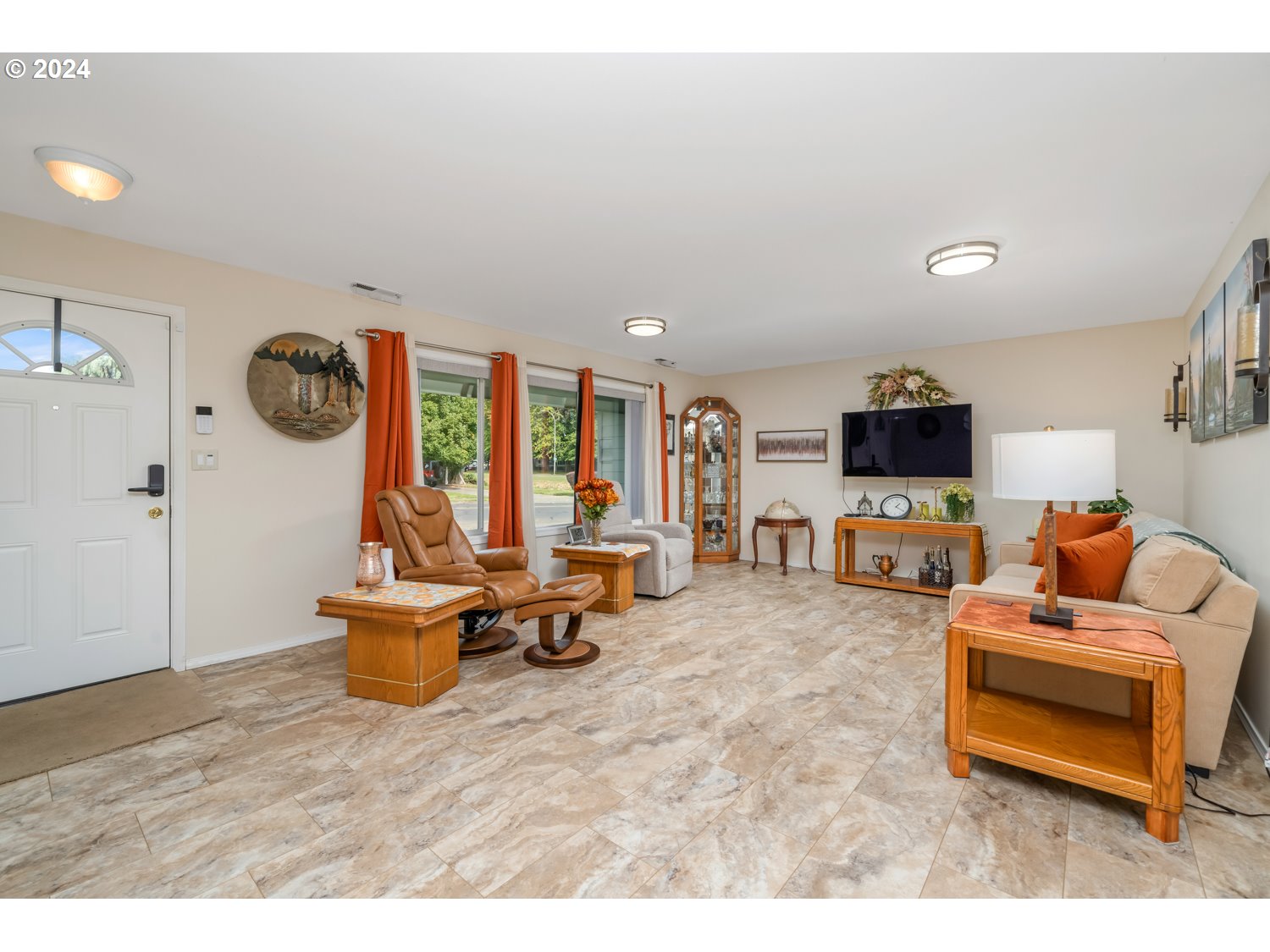 3217 Maple Street Longview, WA 98632 - Photo 6 of 32 a living room with furniture and a flat screen tv