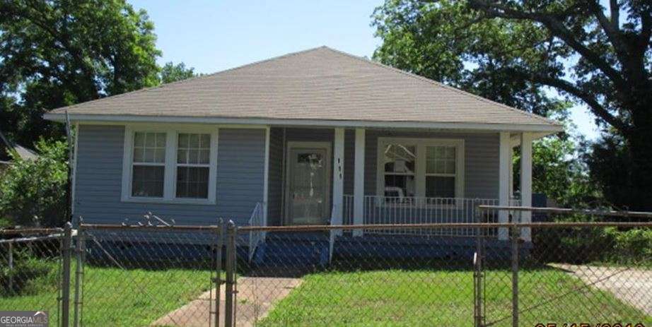 216 4th Avenue Southeast Thomaston, GA 30286 - Photo 4 of 7 a front view of a house with a yard