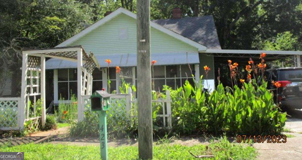 216 4th Avenue Southeast Thomaston, GA 30286 - Photo 5 of 7 a view of a small garden in front of a house